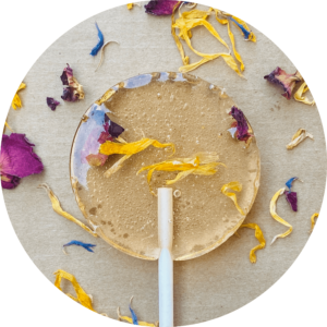 transparent lollipop with edible flowers in it