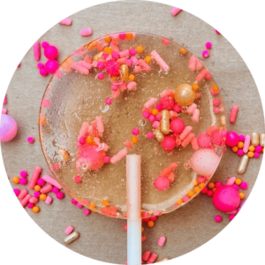 Picture of a transparent lollipop with candy sprinkles in it